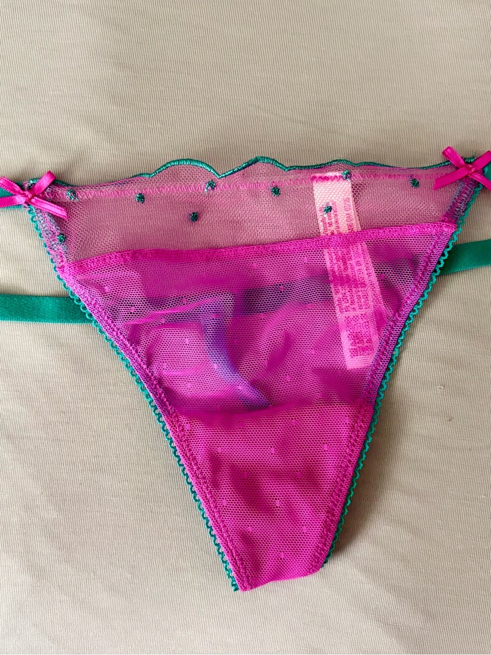 Pink sheer g string with green trim